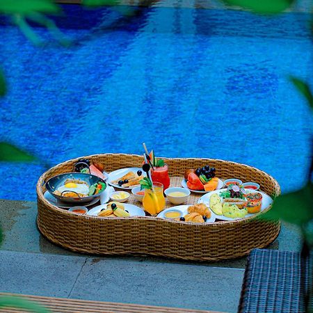Отель Swiss-Belexpress Kuta Legian Экстерьер фото
